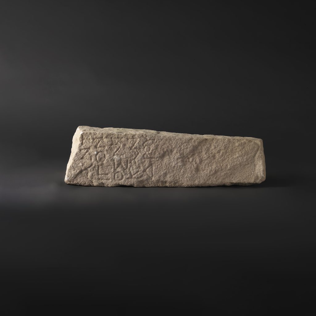 Pillar-shaped inscribed fragment